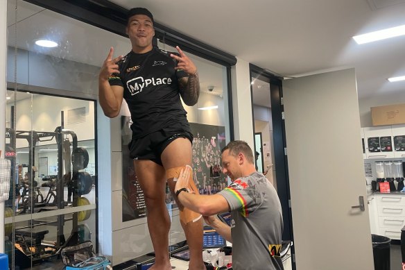 Brian To’o being strapped up by Penrith Panthers physio Mitch Delahay.