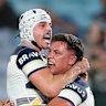 Reed Mahoney celebrates a Cowboys try with Scott Drinkwater.