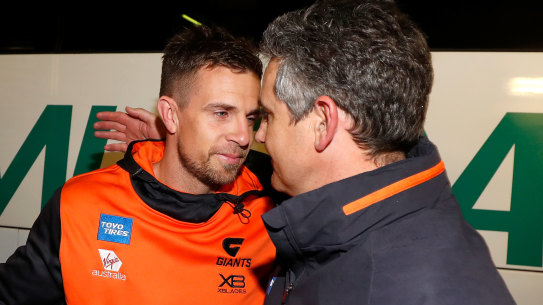 Brett Deledio, left, with Giants coach Leon Cameron, right, last year. Deledio had joined Hawthorn as a development coach but has been let go. 