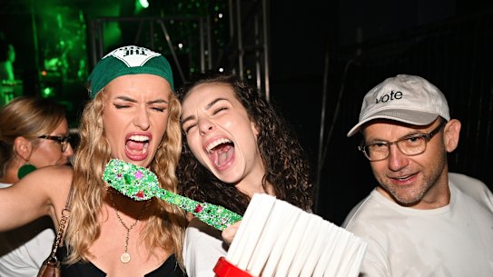 Greens leader Adam Bandt and influencers Abbie Chatfield (centre) and Holly MacAlpine, pose for photos with toothbrushes symbolising the minor party’s plan to put dental care in Medicare.