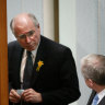 John Howard talks to then Labor leader Simon Crean in the House of Representatives in August 2003. Days later, Howard would convince his cabinet to dump support for an emissions trading scheme.