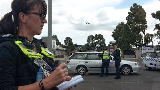 Victoria Police issue fines at a protest  in Preston.