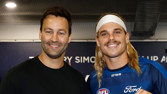 Jimmy Bartel presents Bailey Smith with his Geelong jumper.