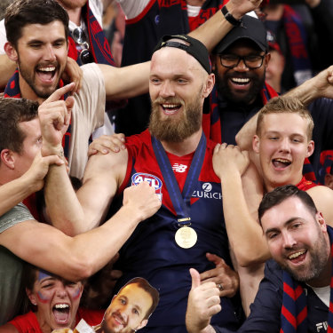 Gawn celebrates with fans after Melbourne’s 2021 AFL grand final victory. 