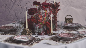 Go burgundy: Porcelain tableware plus placemats and napkins from Dior in the house’s iconic Toile de Jouy motif.