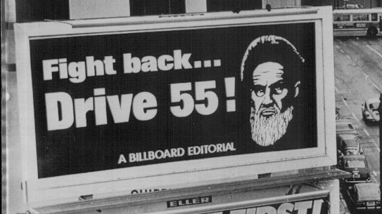 San Francisco, January 1980: The image of Iran's Ayatollah Khomeini is used to encourage motorists to conserve petrol.
