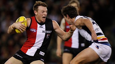 Brendon Goddard gets around Crow Ricky Henderson.
