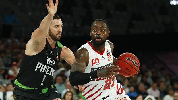 Fast break: Terrico White drives forward for Perth against South East Melbourne at Melbourne Arena.