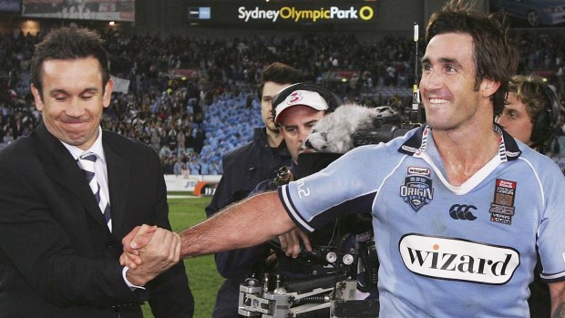 Commentator Matthew Johns (left) with his brother Andrew, at the end of a State of Origin match.