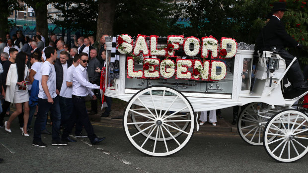 Mourners attend the funeral procession of Paul Massey in Manchester in 2015.