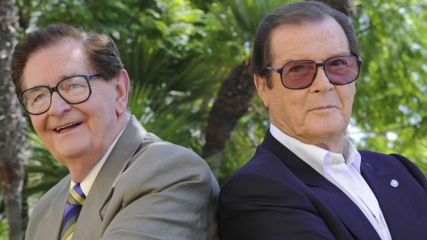 Collins with James Bond star Roger Moore.
