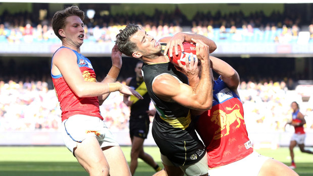 Tiger Alex Rance flies for a mark.