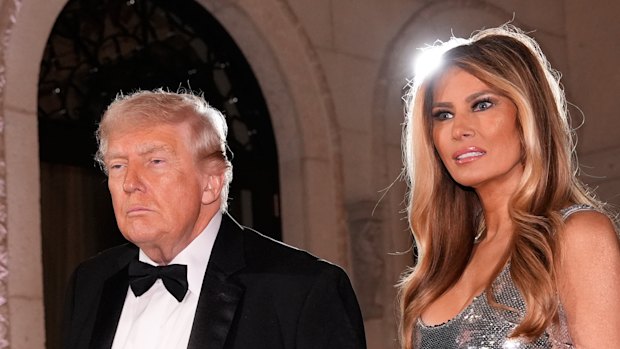 President Donald Trump and First Lady Melania Trump arrive for a New Year’s Eve celebration at their Mar-a-Lago club. 