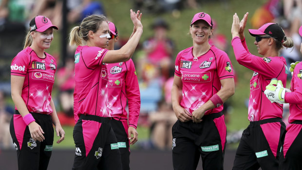 Unstoppable: The Sixers celebrate the wicket of Emma Inglis taken by – who else? – Ellyse Perry.