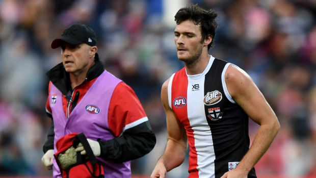St Kilda's Dylan Roberton comes off in round four after collapsing against the Cats in Geelong.