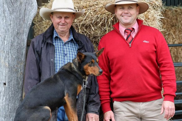 Chris Stapleton, left, and auctioneer Jason Pearce with Eve, Australia’s most expensive kelpie.