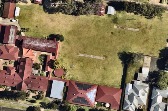 Asbestos was found on the Warwick Central State School oval six years ago. The Queensland government is now suing those it believes responsible for the tainted topsoil.