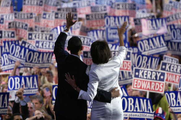 Barack and Michelle Obama wave after the then candidate for the Senate had delivered a keynote address to the Democratic National Convention in July, 2004.
