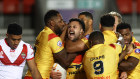 Papua New Guinea players celebrate during their game against Tonga at the World Cup. 