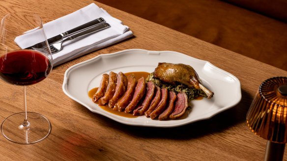 Half-roast duck cooked on the wood grill with jus gras.