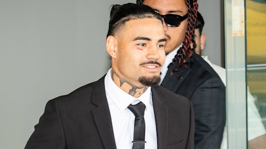 Taylan May (centre) leaves Penrith Local Court flanked by his brother Terrell (left).