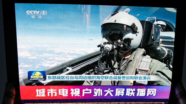 Chinese air force flies through unofficial barrier with Taiwan, stoking tension ahead of election