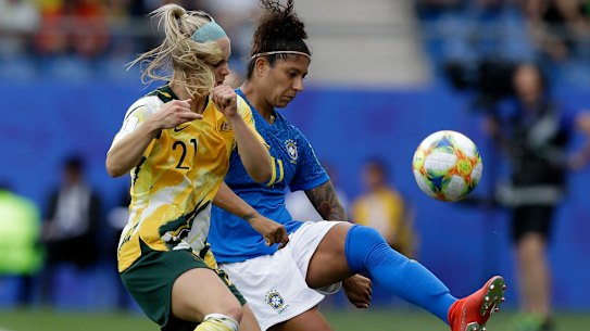 Australia's Ellie Carpenter battles with Brazil's Cristiane.
