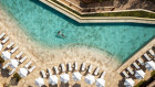 A guest luxuriates in one of two swimming pools at Six Senses Ibiza. 