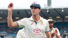 Pat Cummins leaves the field after taking his fifth match wicket at the SCG on Wednesday.