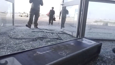 Glass and debris covers the damaged portion of the airport in Yemen’s southern city of Aden after an explosion.