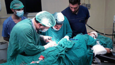 A victim injured by shelling in the town of Suqailabiyah undergoes surgery at a hospital in Hama, Syria, last week.