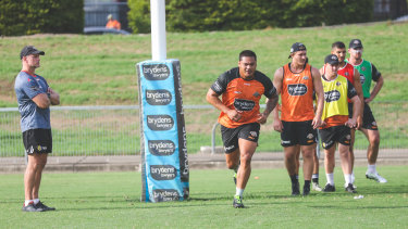 Tigers coach Michael Maguire watches on at training.