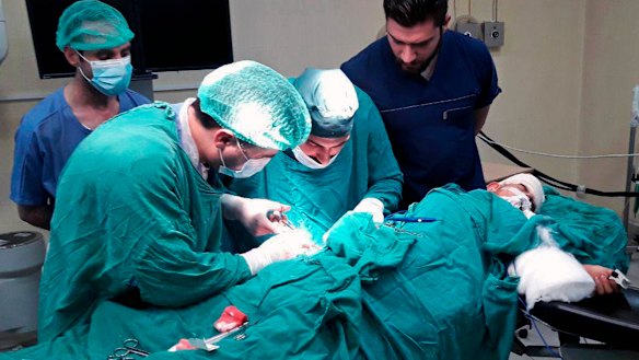 A victim injured by shelling in the town of Suqailabiyah undergoes surgery at a hospital in Hama, Syria, last week.