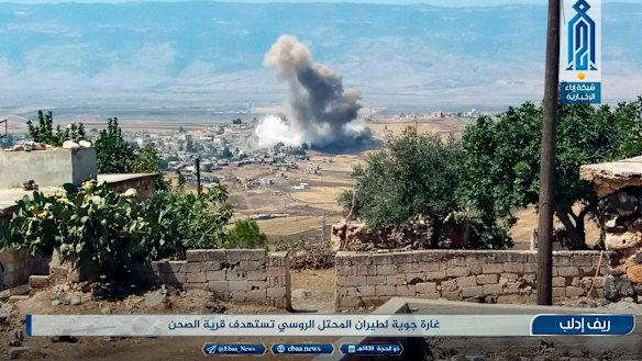 Smoke rising over buildings that were hit by airstrikes, in al-Sahan village, Idlib, Syria, on Tuesday.