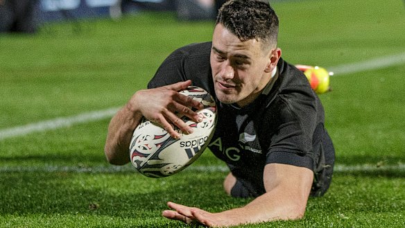 Will Jordan crosses for one of his five tries against Tonga. 