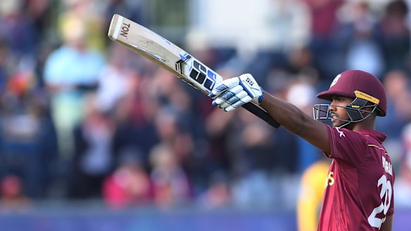 Ton of fun: West Indies' batsman Nicholas Pooran salutes after raising his century.