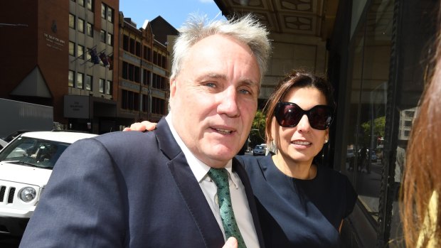 Michael Cranston and his wife Gloria leave the Downing Centre Courts in Sydney on Friday.