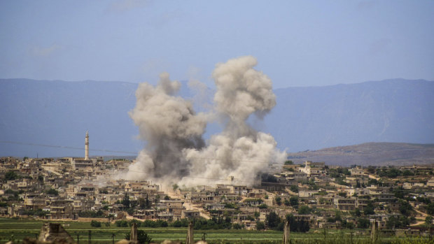 Smoke rises after Syrian government and Russian airstrikes hit the Syrian town of al-Habeet in southern Idlib on Friday.