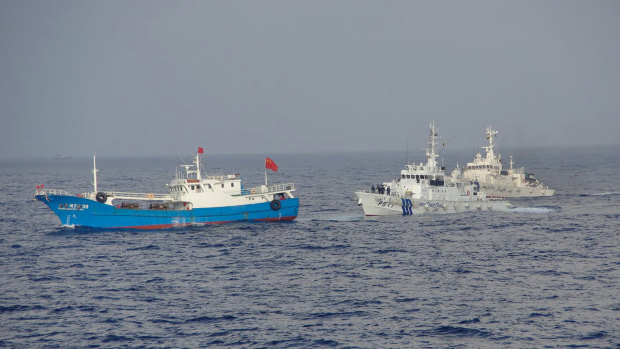 Japan Coast Guard patrol boats approach a Chinese fishing boat, left, in 2013, off the north-eastern coast of Miyako island, about 200 kilometres south-west of the disputed islands called Senkaku in Japan and Diaoyu in China. 