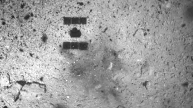 This image released by the Japan Aerospace Exploration Agency (JAXA) shows the shadow of the Hayabusa2 spacecraft after its successful touchdown on the asteroid Ryugu in February.