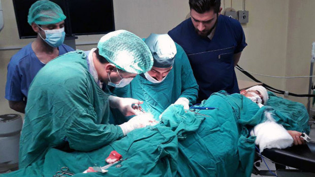 A victim injured by shelling in the town of Suqailabiyah undergoes surgery at a hospital in Hama, Syria, last week.