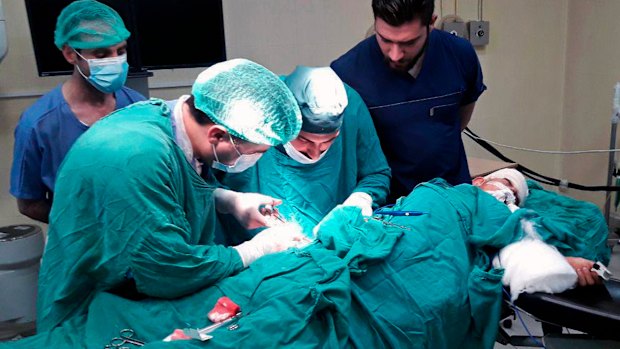 A victim injured by shelling in the town of Suqailabiyah undergoes surgery at a hospital in Hama, Syria, last week.