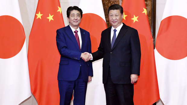 Japanese Prime Minister Shinzo Abe (left) with Chinese President Xi Jinping before a meeting at the Diaoyutai State Guesthouse in Beijing.