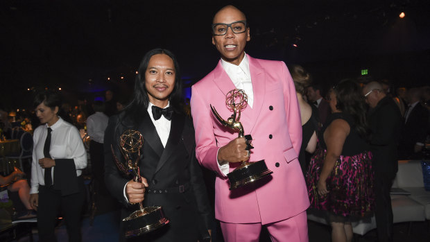 Threepeat: RuPaul Charles, right, has claimed a hat trick of Emmy awards for outstanding host for a reality or reality-competition program.