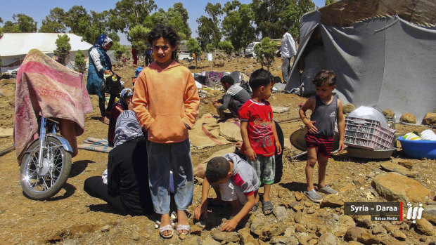 People who fled from Daraa province, gathering in the Quneitra countryside, near the Israeli-occupied Golan Heights, Syria. 