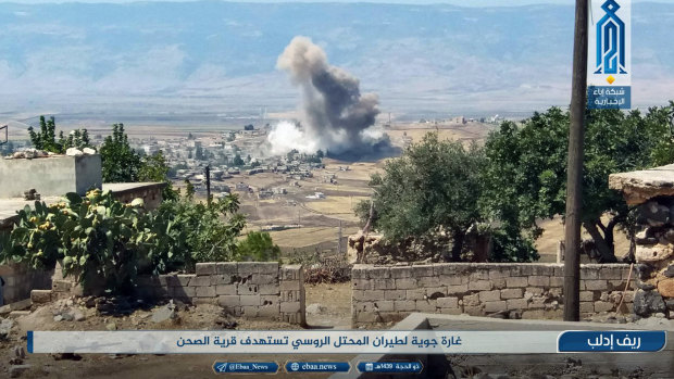 Smoke rising over buildings that were hit by airstrikes, in al-Sahan village, Idlib, Syria, on Tuesday.