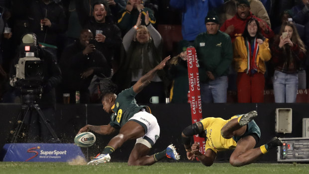 Late lunge: Samu Kerevi can't stop South Africa's S'bu Nkosi scoring in the corner.
