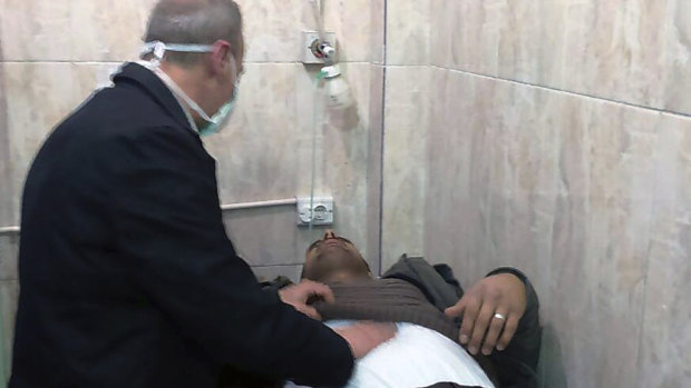This photo released by the Syrian official news agency SANA, shows a man receiving treatment at a hospital following a suspected chemical attack on his town of al-Khalidiya, in Aleppo, Syria, on Saturday.