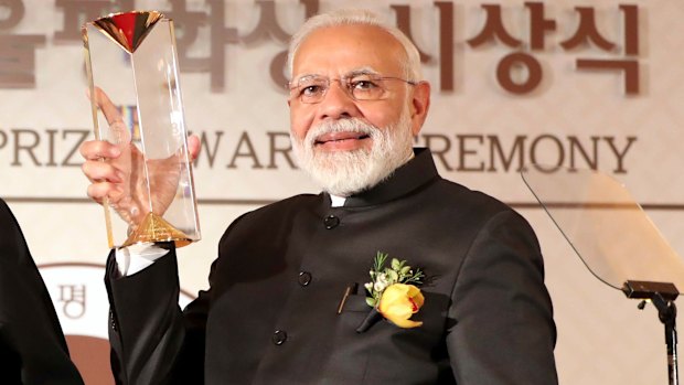 Indian Prime Minister Narendra Modi receives the Seoul Peace Prize during the 14th Seoul Peace Prize award ceremony in Seoul, South Korea, on Friday/