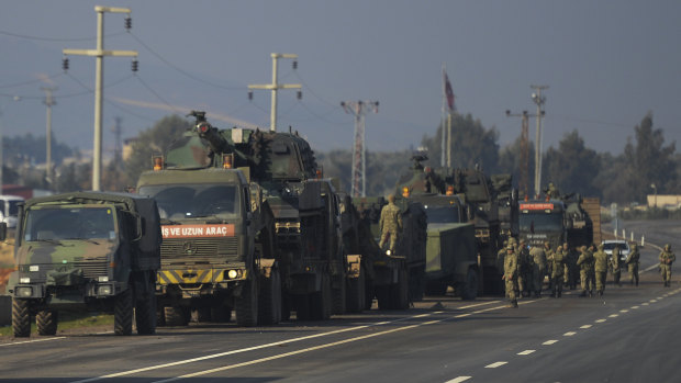 Turkish troops and artillery prepare to enter Syria in Reyhanli, Turkey. 